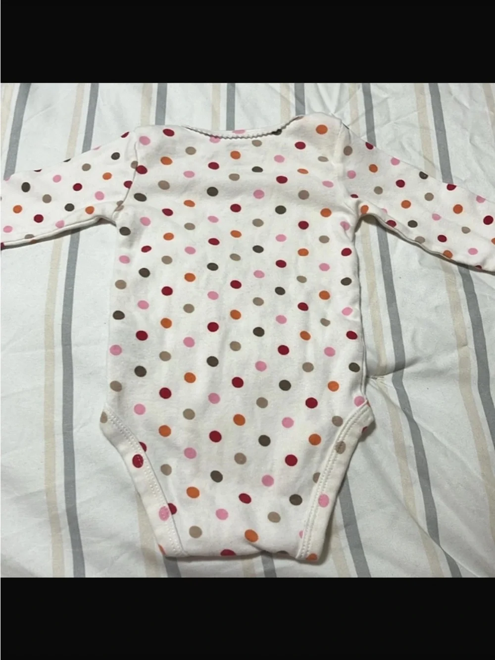 Carter's Polka-Dot long sleeved onesie with flower on chest, snaps